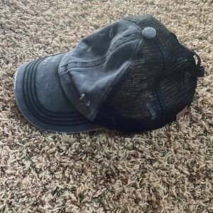 Black and Grey cc exclusives distressed hat with ponytail holder.